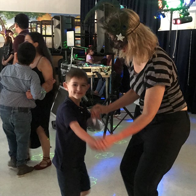 Mothers and sons have a great time dancing it out at the annual mother son dance!