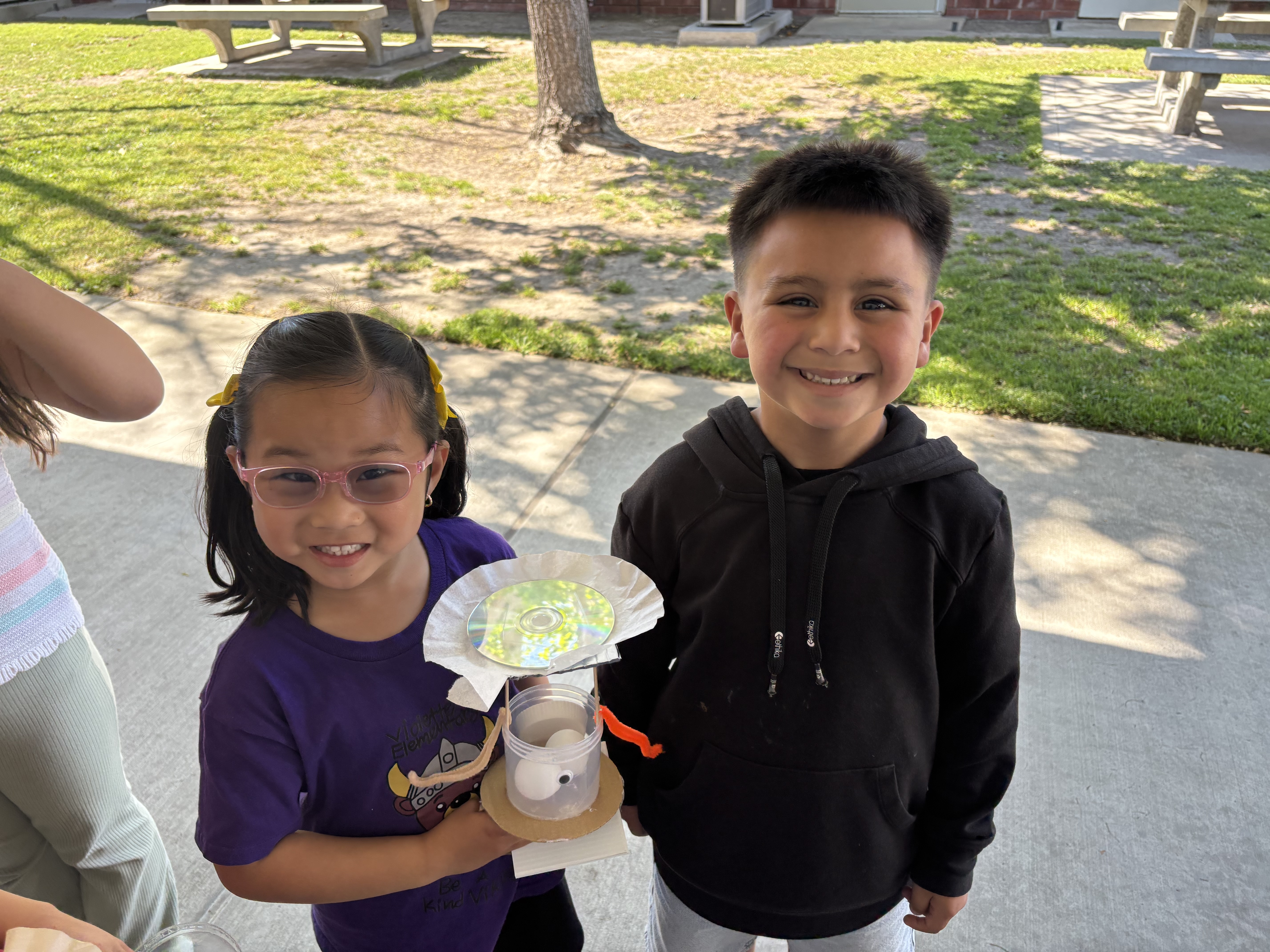Students proudly showcase their creative invention during the Child Creativity Lab!