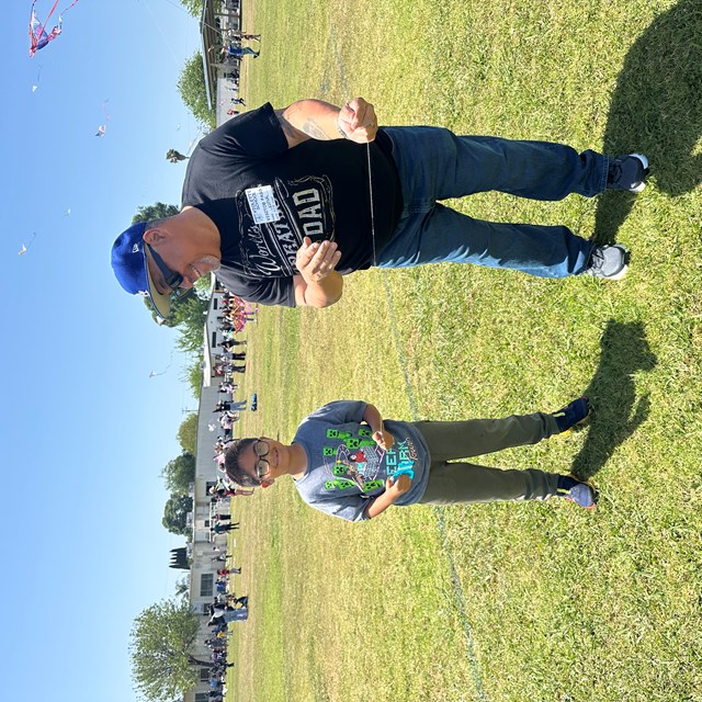 This student is excited to see his kite soar into the air!