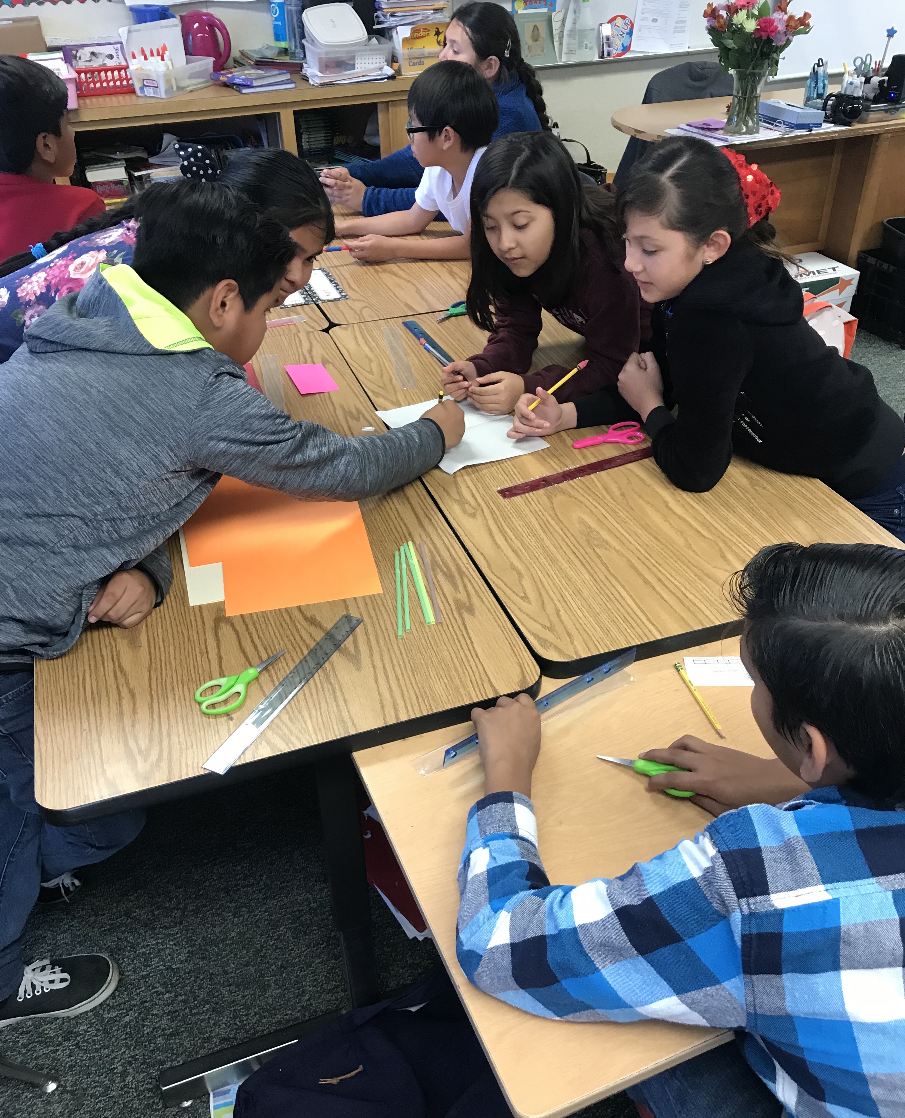 Boeing engineers challenge Violette students with an activity that they are quick to work on.