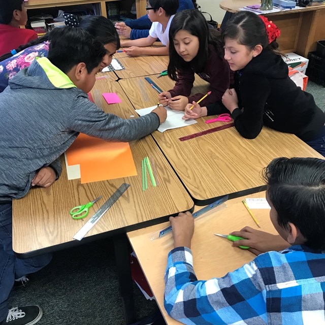 Boeing engineers challenge Violette students with an activity that they are quick to work on.