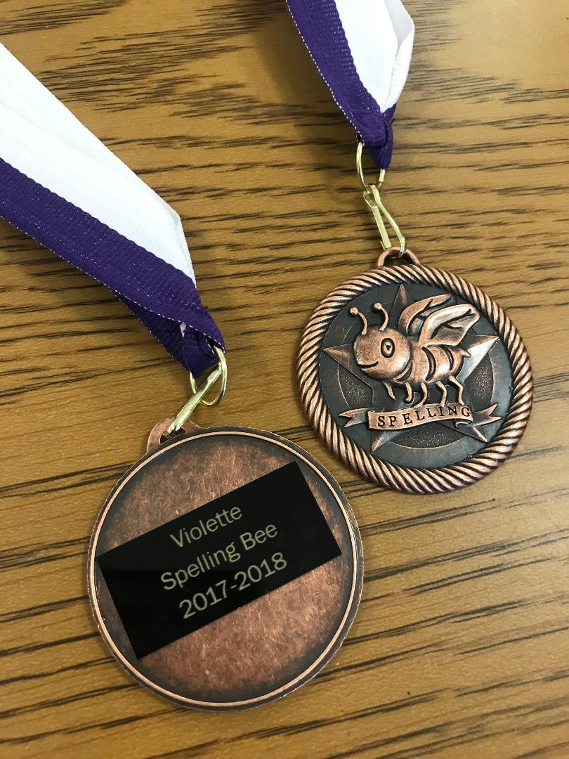 Everyone walks away a winner at Violette's spelling bee! These lovely medals are handed out to all contestants!