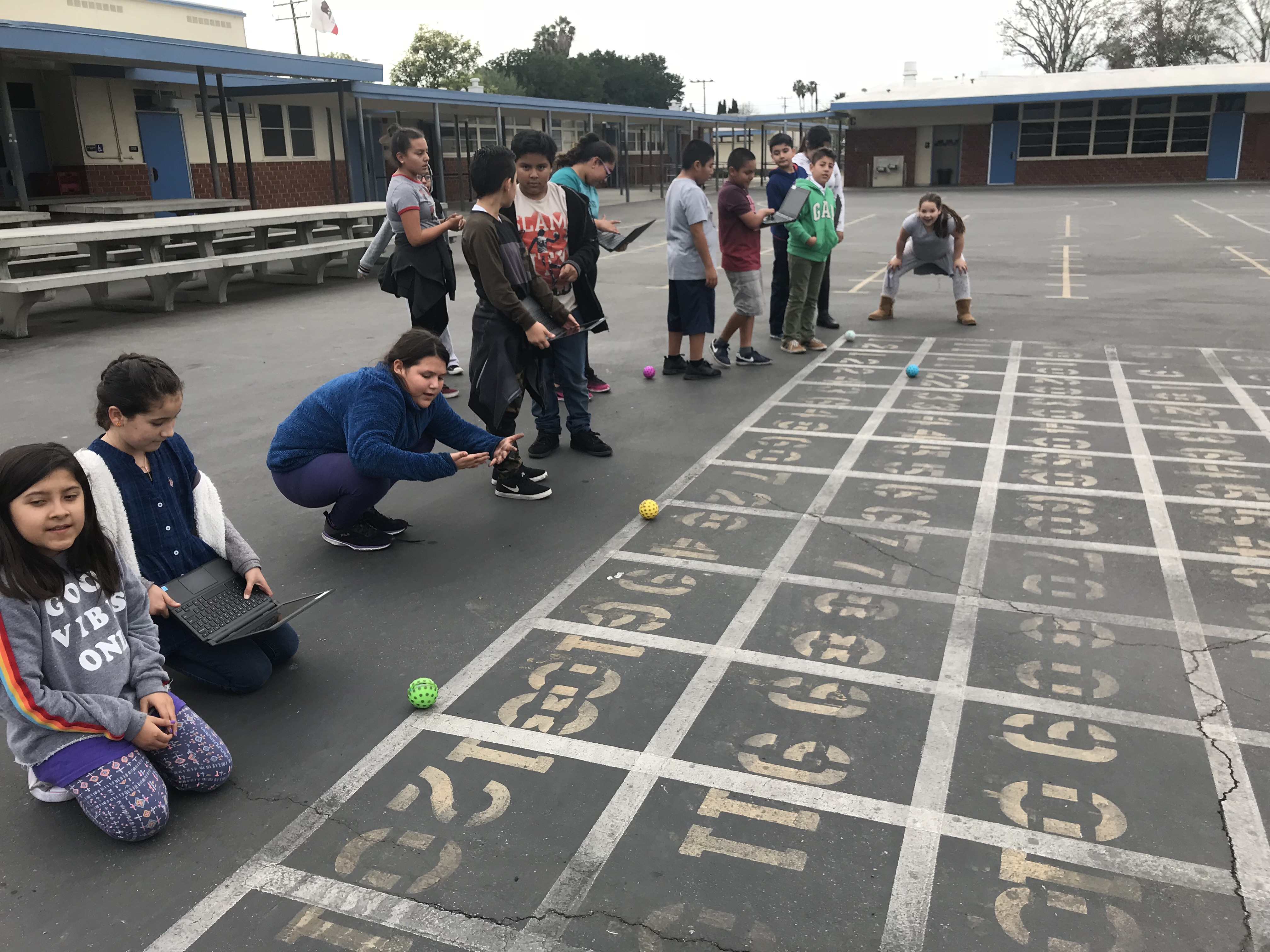 Students work together after school in the robotics club to broaden their perspective on technology!