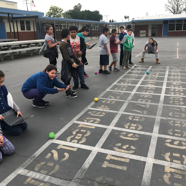 Students work together after school in the robotics club to broaden their perspective on technology!